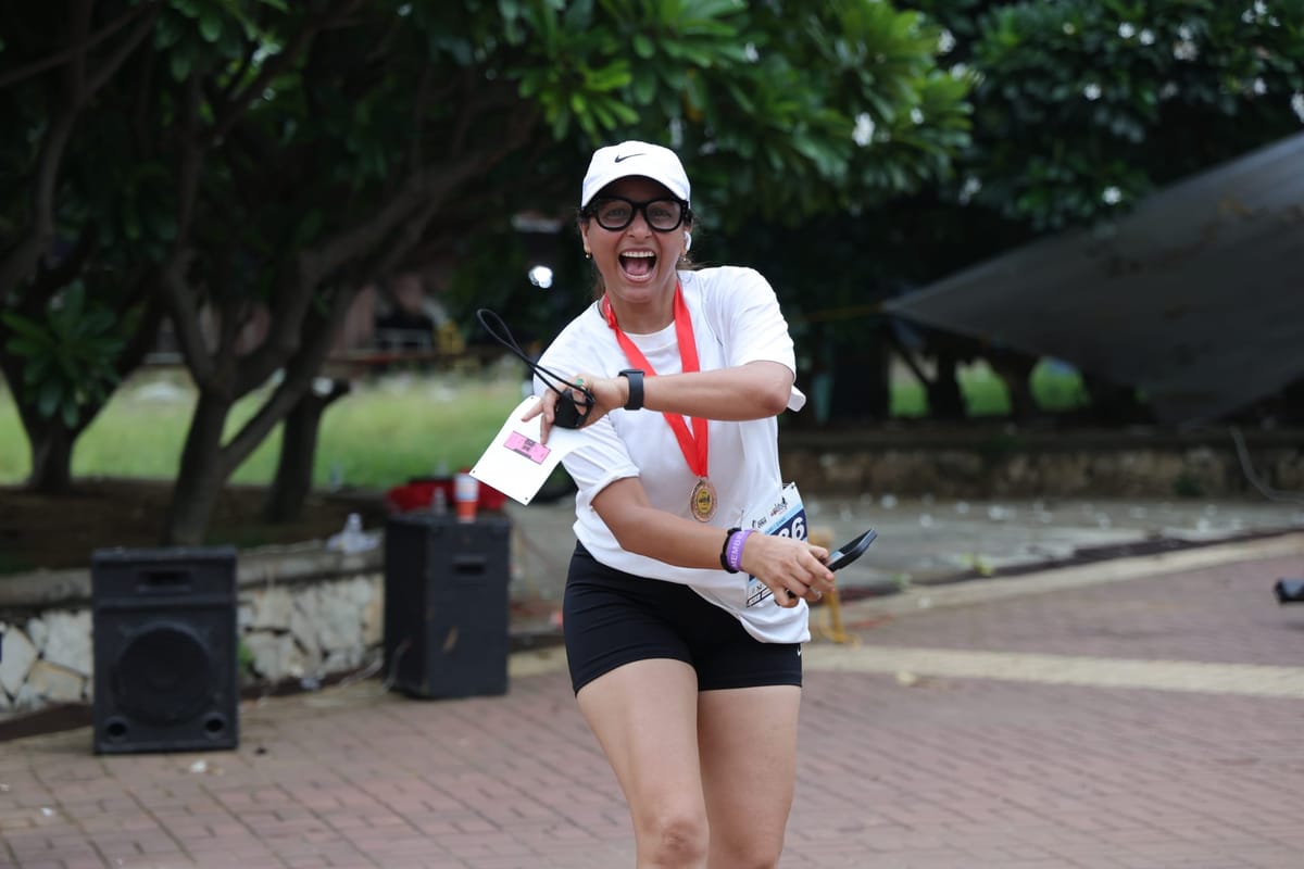 Finisher celebrating with medal